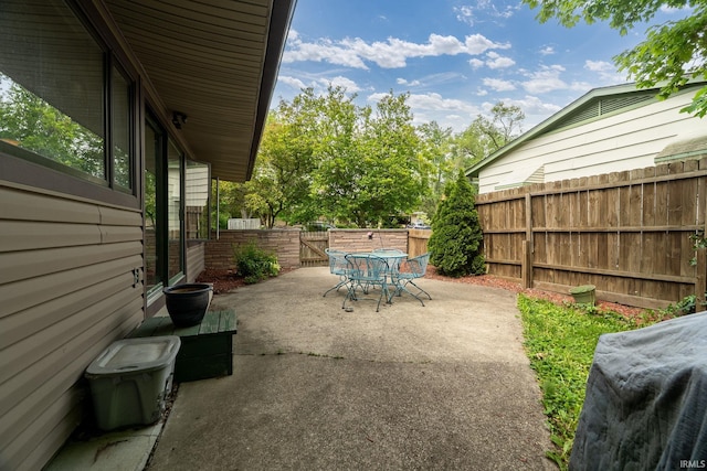 view of patio / terrace with a fenced backyard and outdoor dining space