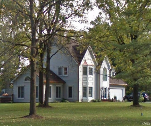15560 Menominee Dr, Plymouth, IN 46563 - view of front of house featuring a front yard and a garage