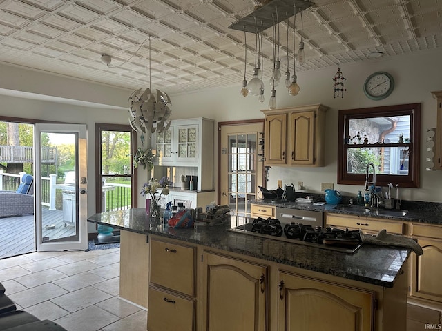 15560 Menominee Dr, Plymouth, IN 46563 - kitchen featuring a sink, a kitchen island, white gas stovetop, an ornate ceiling, and light tile patterned floors