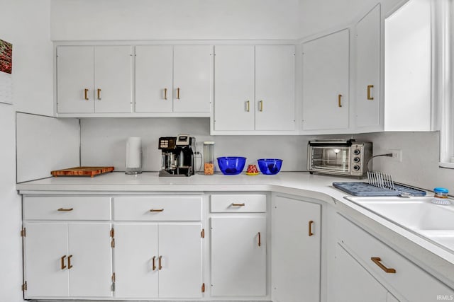 1500 El Prado St, Lafayette, IN 47905 - kitchen featuring white cabinets and light countertops
