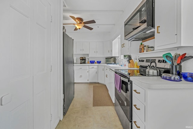 1500 El Prado St, Lafayette, IN 47905 - kitchen featuring stainless steel appliances, light countertops, white cabinetry, a ceiling fan, and a sink