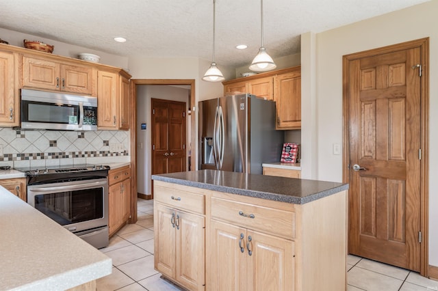 9725 Sea View Cv, Fort Wayne, IN 46835 - kitchen with appliances with stainless steel finishes, light tile patterned floors, tasteful backsplash, hanging light fixtures, and a kitchen island
