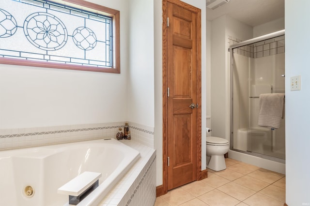 9725 Sea View Cv, Fort Wayne, IN 46835 - bathroom featuring tile patterned flooring, a stall shower, a jetted tub, and toilet