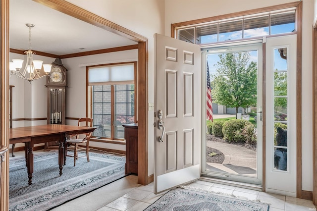 9725 Sea View Cv, Fort Wayne, IN 46835 - entrance foyer featuring a chandelier, light tile patterned floors, and crown molding