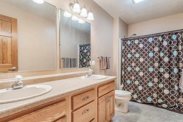 9725 Sea View Cv, Fort Wayne, IN 46835 - full bathroom featuring curtained shower, toilet, double vanity, and a textured ceiling