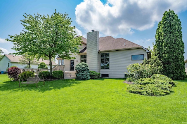 9725 Sea View Cv, Fort Wayne, IN 46835 - rear view of house with a chimney, a lawn, and a shingled roof