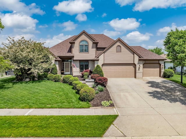 9725 Sea View Cv, Fort Wayne, IN 46835 - view of front of home featuring a front yard, brick siding, an attached garage, and concrete driveway