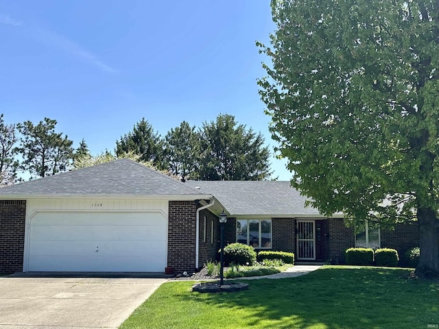 1309 Lea Ct, Frankfort, IN 46041 - ranch-style home with brick siding, an attached garage, a front yard, and concrete driveway