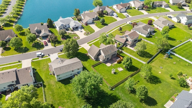 aerial perspective of suburban area featuring a nearby body of water