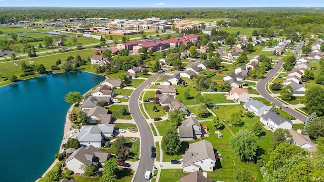 aerial perspective of suburban area with a large body of water