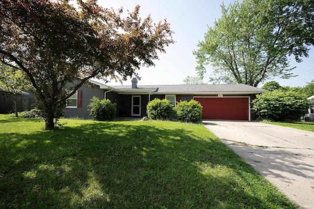 2113 W Christy Ln, Muncie, IN 47304 - ranch-style house with a garage, driveway, a front yard, and a chimney