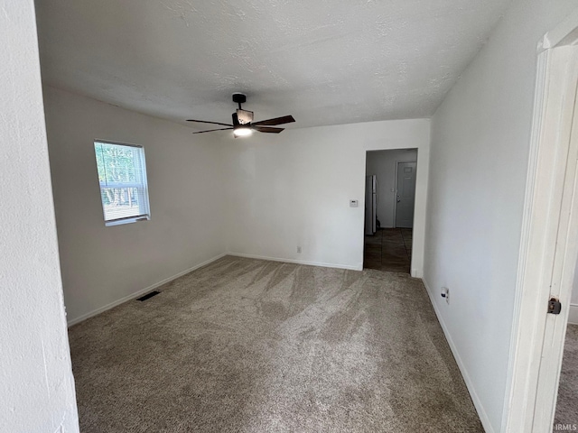 721 S Hackley St, Muncie, IN 47302 - unfurnished room featuring a ceiling fan, carpet flooring, and baseboards