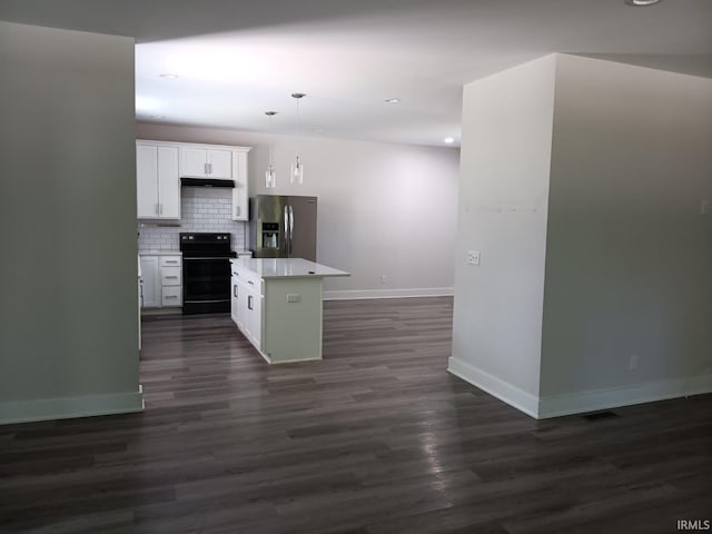 224 E 6th Ave, Ingalls, IN 46048 - kitchen with black electric range, stainless steel fridge with ice dispenser, baseboards, a kitchen island, and dark wood-style floors