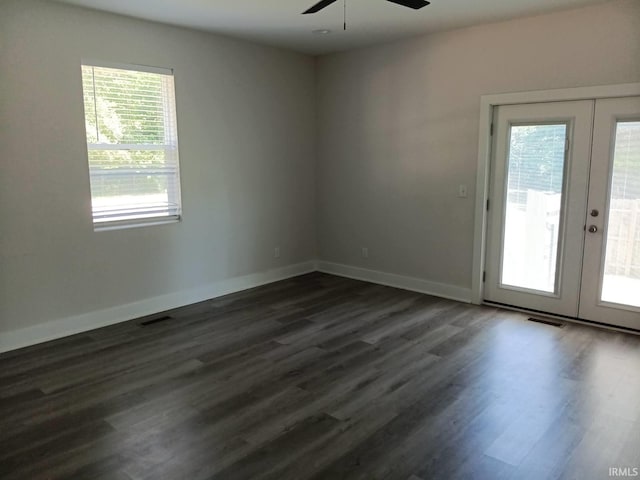 224 E 6th Ave, Ingalls, IN 46048 - empty room featuring french doors, a ceiling fan, dark wood finished floors, and baseboards