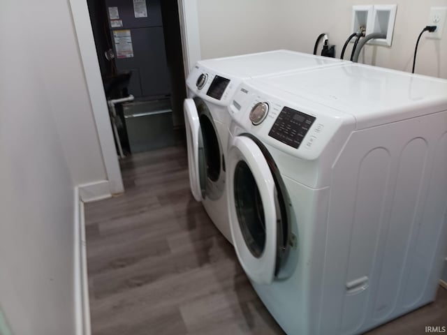 224 E 6th Ave, Ingalls, IN 46048 - washroom featuring washing machine and clothes dryer and wood finished floors