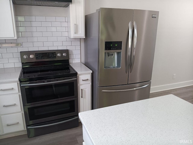 224 E 6th Ave, Ingalls, IN 46048 - kitchen with appliances with stainless steel finishes and white cabinets