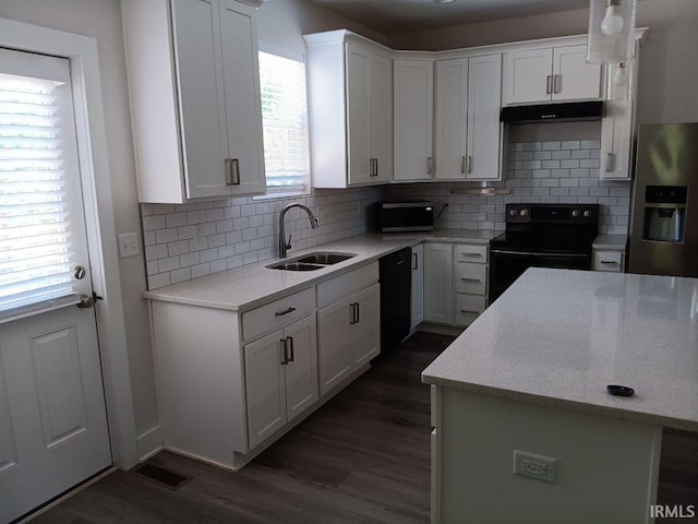224 E 6th Ave, Ingalls, IN 46048 - kitchen with black appliances, a sink, dark wood-type flooring, and white cabinets
