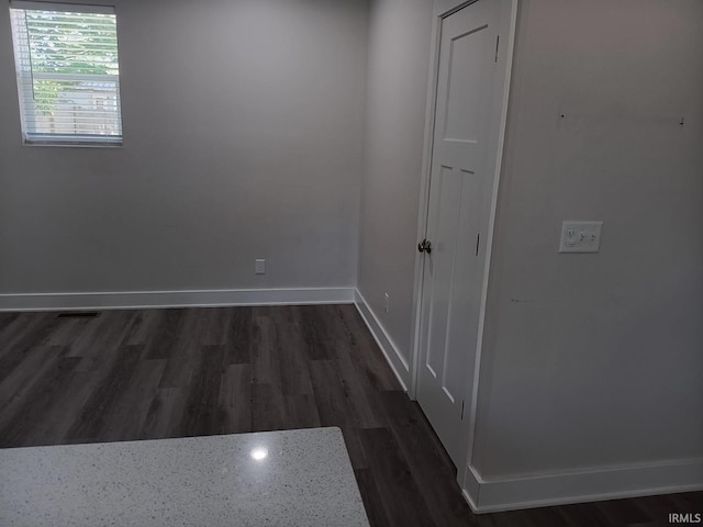 224 E 6th Ave, Ingalls, IN 46048 - spare room with dark wood-style flooring and baseboards