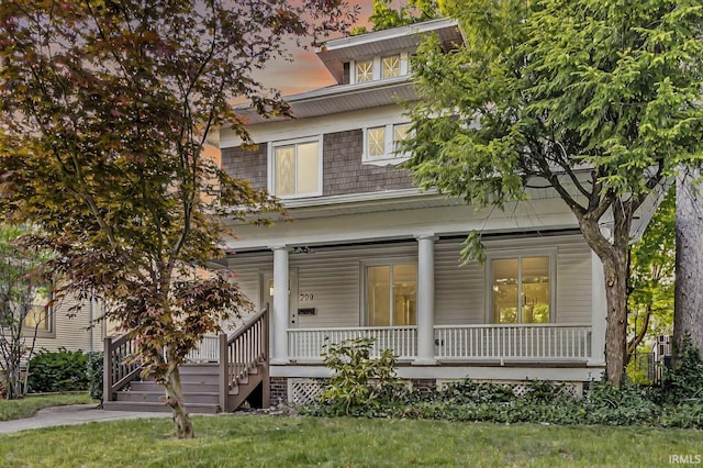 209 Marquette Ave, South Bend, IN 46617 - american foursquare style home with a porch and a front lawn