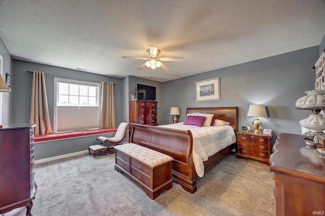 1177 E Marigold Dr, Bloomington, IN 47401 - carpeted bedroom with ceiling fan and a textured ceiling