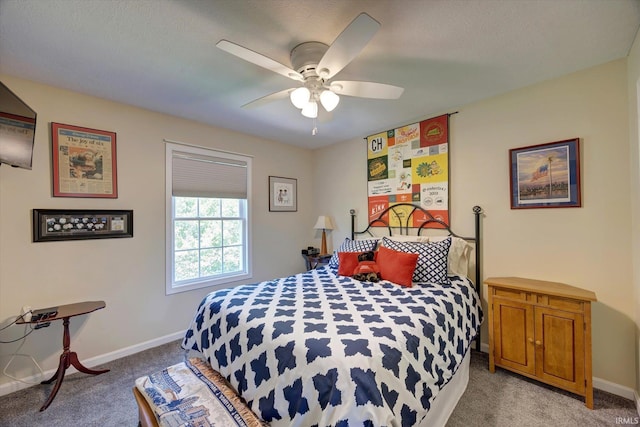 1177 E Marigold Dr, Bloomington, IN 47401 - bedroom featuring light colored carpet, baseboards, and a ceiling fan