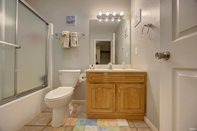 1177 E Marigold Dr, Bloomington, IN 47401 - bathroom featuring vanity, toilet, baseboards, and combined bath / shower with glass door