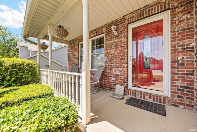1177 E Marigold Dr, Bloomington, IN 47401 - entrance to property with covered porch and brick siding