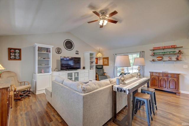 1177 E Marigold Dr, Bloomington, IN 47401 - living room featuring a ceiling fan, vaulted ceiling, and wood finished floors