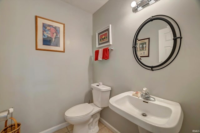 1177 E Marigold Dr, Bloomington, IN 47401 - bathroom featuring a sink, baseboards, toilet, and tile patterned flooring