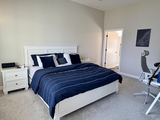 bedroom featuring carpet flooring and baseboards