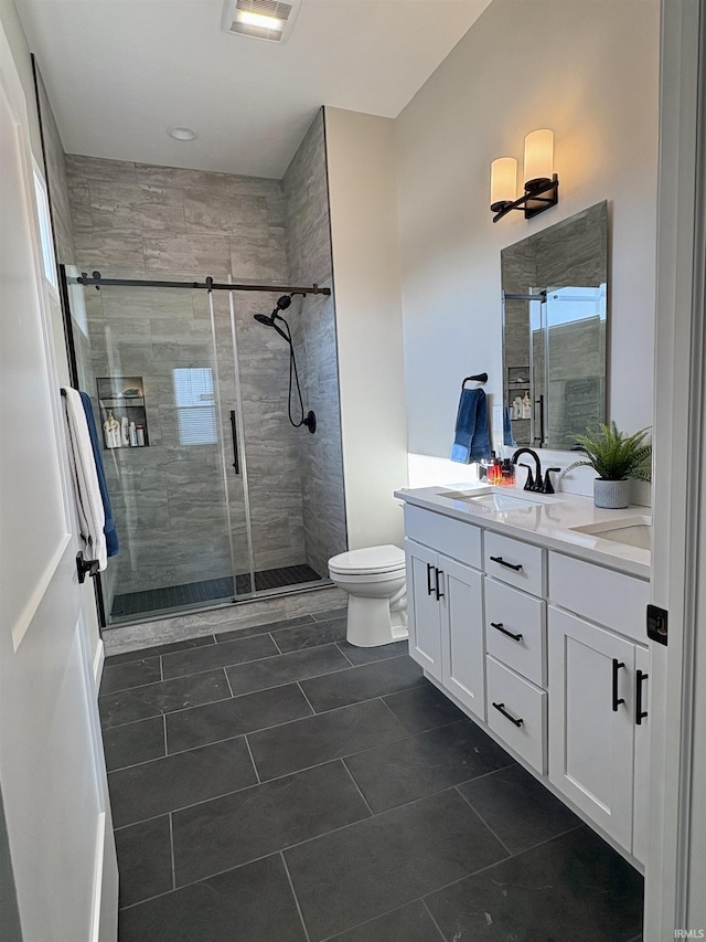 full bath with toilet, a stall shower, tile patterned flooring, double vanity, and recessed lighting