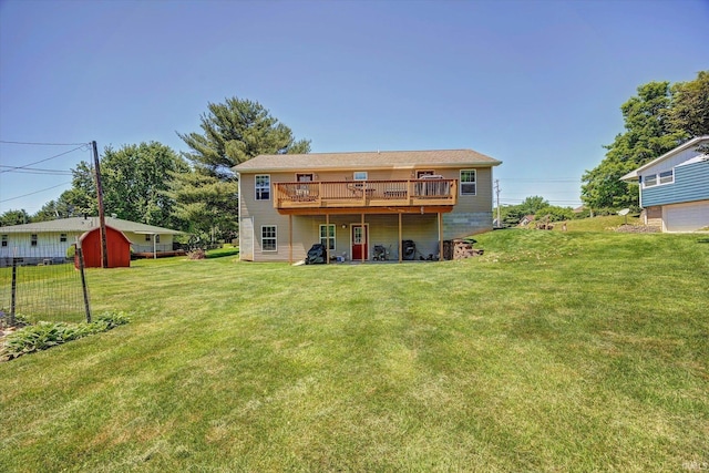 4110 E 10th St, Bloomington, IN 47408 - back of property featuring a lawn, a deck, and an outdoor structure