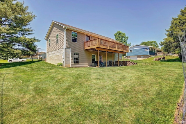 4110 E 10th St, Bloomington, IN 47408 - rear view of house featuring a lawn and a deck