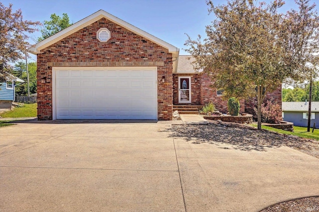 4110 E 10th St, Bloomington, IN 47408 - view of front of property with brick siding and driveway