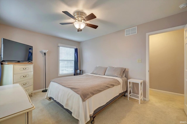 4110 E 10th St, Bloomington, IN 47408 - bedroom with light carpet, baseboards, and ceiling fan