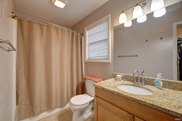 4110 E 10th St, Bloomington, IN 47408 - full bath featuring vanity, toilet, shower / tub combo, and tile patterned flooring