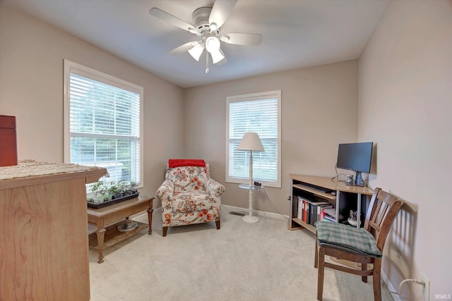 4110 E 10th St, Bloomington, IN 47408 - home office with light carpet, a ceiling fan, and baseboards