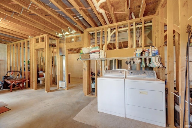 4110 E 10th St, Bloomington, IN 47408 - unfinished basement featuring washing machine and dryer