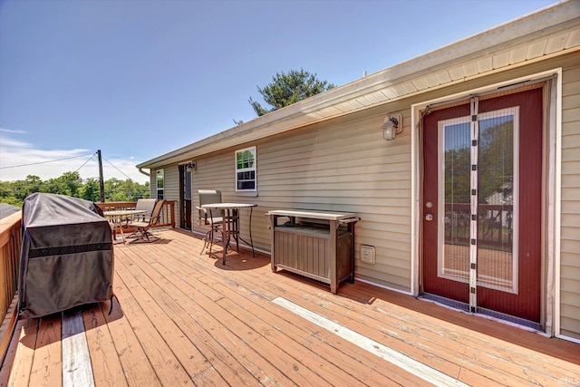 4110 E 10th St, Bloomington, IN 47408 - deck featuring outdoor dining area, area for grilling, and french doors