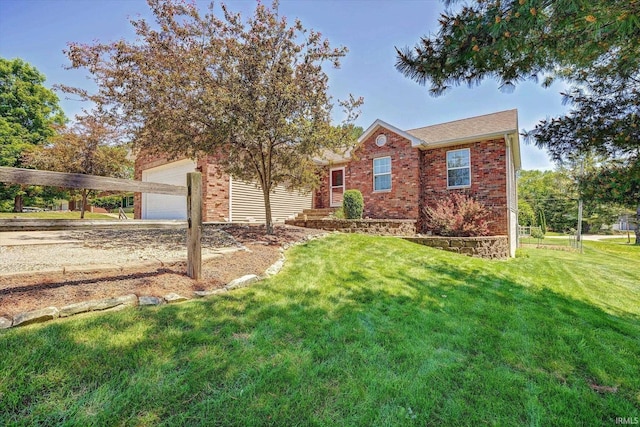 4110 E 10th St, Bloomington, IN 47408 - view of front of home with brick siding, a garage, a front yard, and driveway