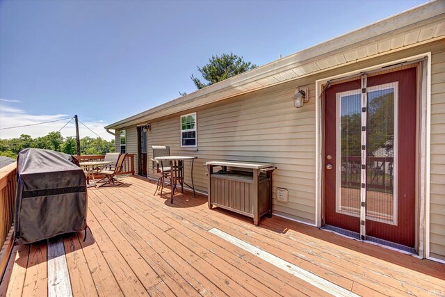 4110 E 10th St, Bloomington, IN 47408 - deck featuring outdoor dining area, area for grilling, and french doors