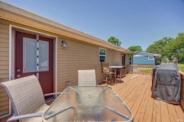 4110 E 10th St, Bloomington, IN 47408 - wooden terrace featuring outdoor dining space