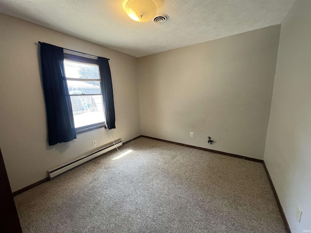3613 Robin Dr, Kokomo, IN 46902 - carpeted spare room featuring a baseboard heating unit, a textured ceiling, and baseboards