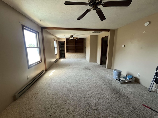 3613 Robin Dr, Kokomo, IN 46902 - spare room featuring a baseboard heating unit, a ceiling fan, carpet flooring, a textured ceiling, and a smoke detector