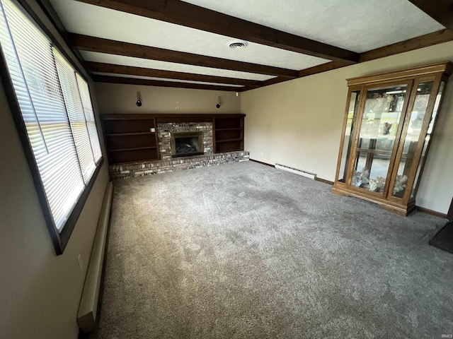 3613 Robin Dr, Kokomo, IN 46902 - unfurnished living room featuring carpet flooring, beamed ceiling, a baseboard radiator, a brick fireplace, and baseboards