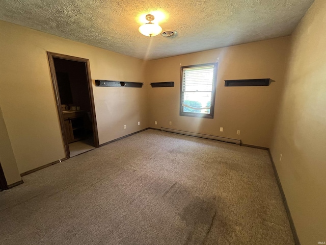 3613 Robin Dr, Kokomo, IN 46902 - carpeted empty room featuring baseboard heating, a textured ceiling, and baseboards