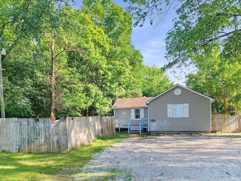4123 Covert Ave, Evansville, IN 47714 - view of front facade featuring fence, a deck, and driveway