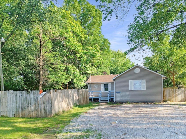 4123 Covert Ave, Evansville, IN 47714 - view of front facade featuring fence, a deck, and driveway