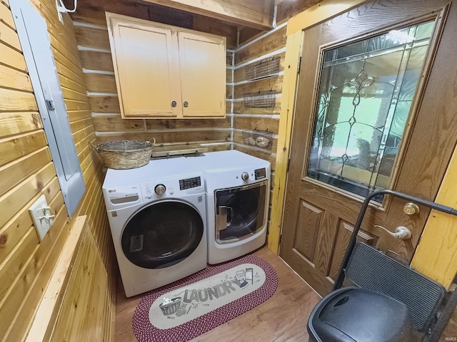 3508 Kampbell Cliff Rd, Birdseye, IN 47513 - laundry area with cabinet space, separate washer and dryer, wood finished floors, and wood walls