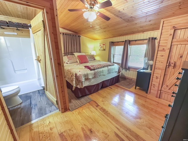 3508 Kampbell Cliff Rd, Birdseye, IN 47513 - bedroom with wooden ceiling, light wood-style flooring, wood walls, ceiling fan, and vaulted ceiling